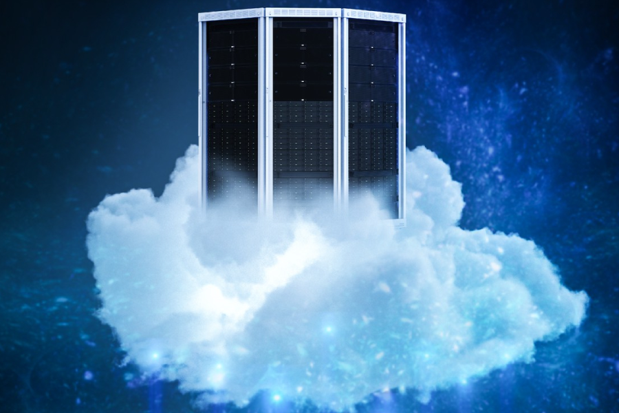 Two individuals in a server room examining a laptop, surrounded by servers and networking equipment.