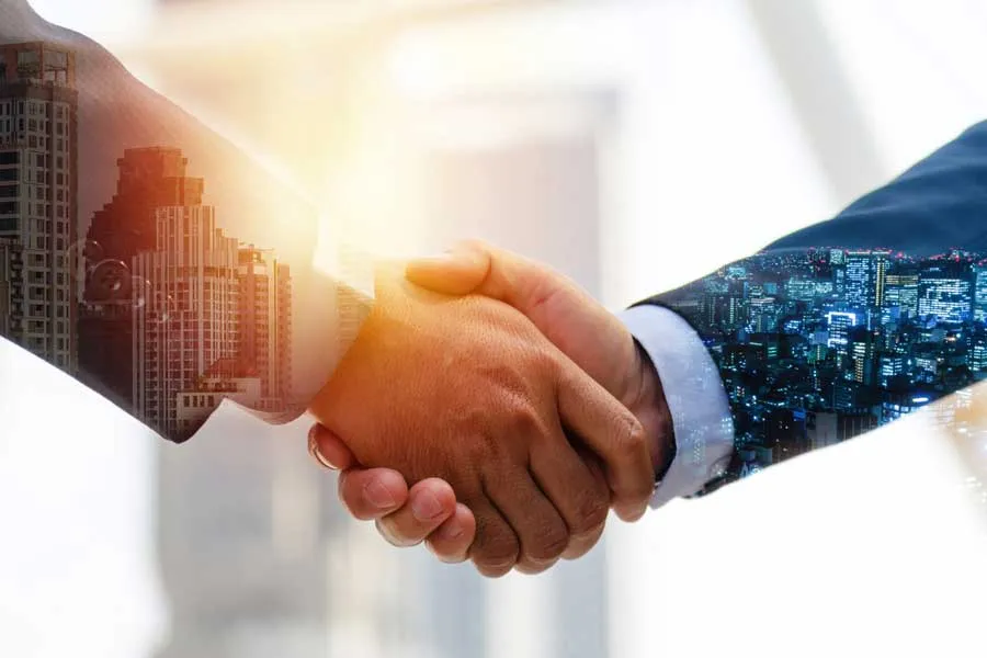two_businessmen_shake_hands
